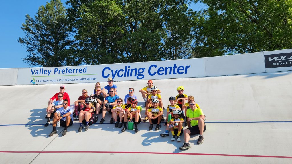 Photo of a group of bikers sitting on a concrete slope
